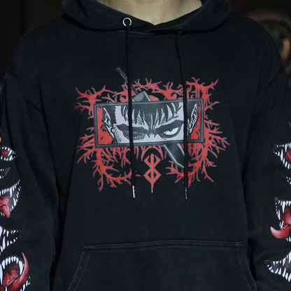 Black hoodie with red and white graphic design on a dark background
