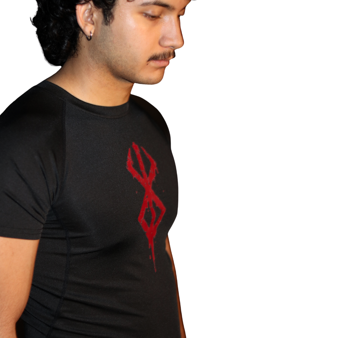 Person wearing a black t-shirt with Brand of Sacrifice compression shirt