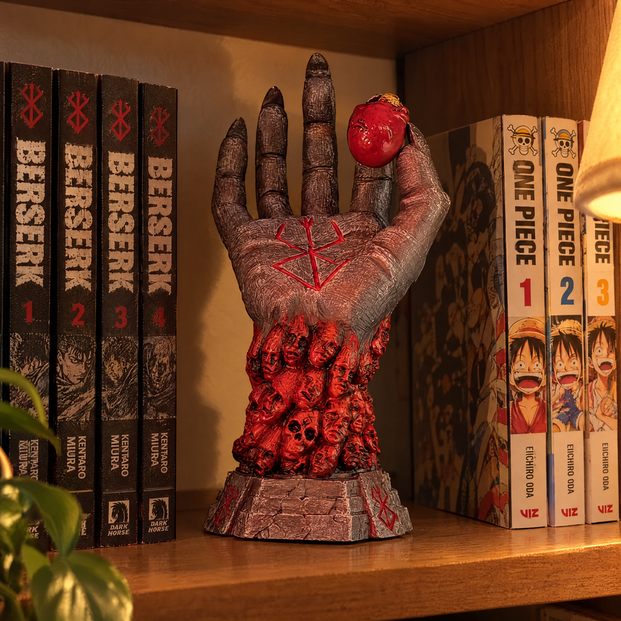 God Hand ornament on a bookshelf